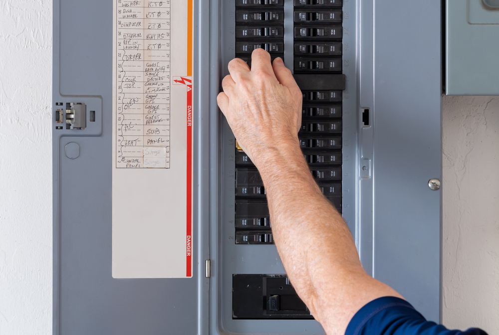 Homeowner flipping breaker in electrical panel